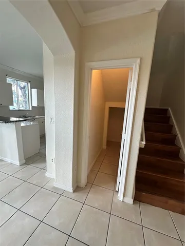 a view of a livingroom with wooden floor and stairs