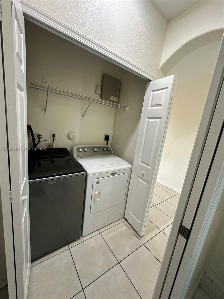 2704 Southeast 15th Place, Unit 152 Homestead, FL 33035 - Photo 9 of 35 a utility room with dryer and washer