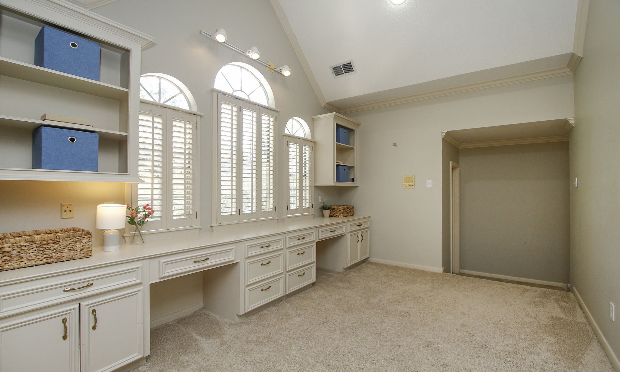 15923 Harwick Drive Spring, TX 77379 - Photo 35 of 50 The study area also features book shelves and drawers. Through the doorway are three secondary bedrooms and two bathrooms.