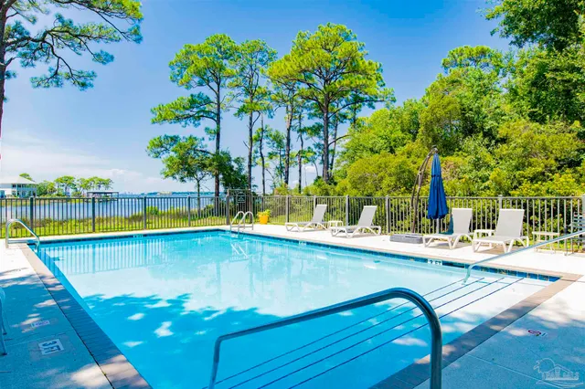 a view of swimming pool with chairs