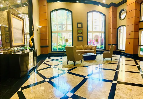 a room with lots of chairs and mirrors