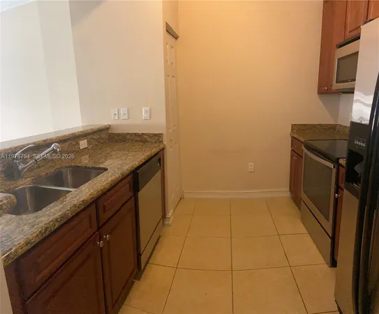 a view of kitchen and a window