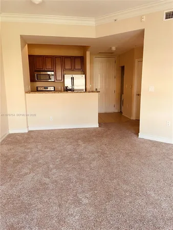 an empty room with closet and a bathroom