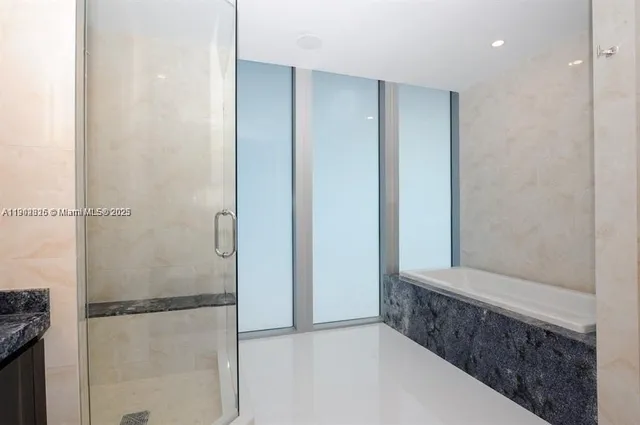 a view of an empty room with glass door