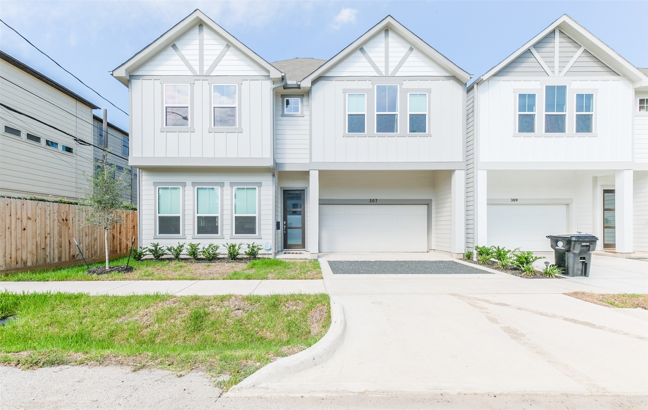 307 Parker Street Houston, TX 77007 - Photo 23 of 25 a front view of a house with a yard and garage
