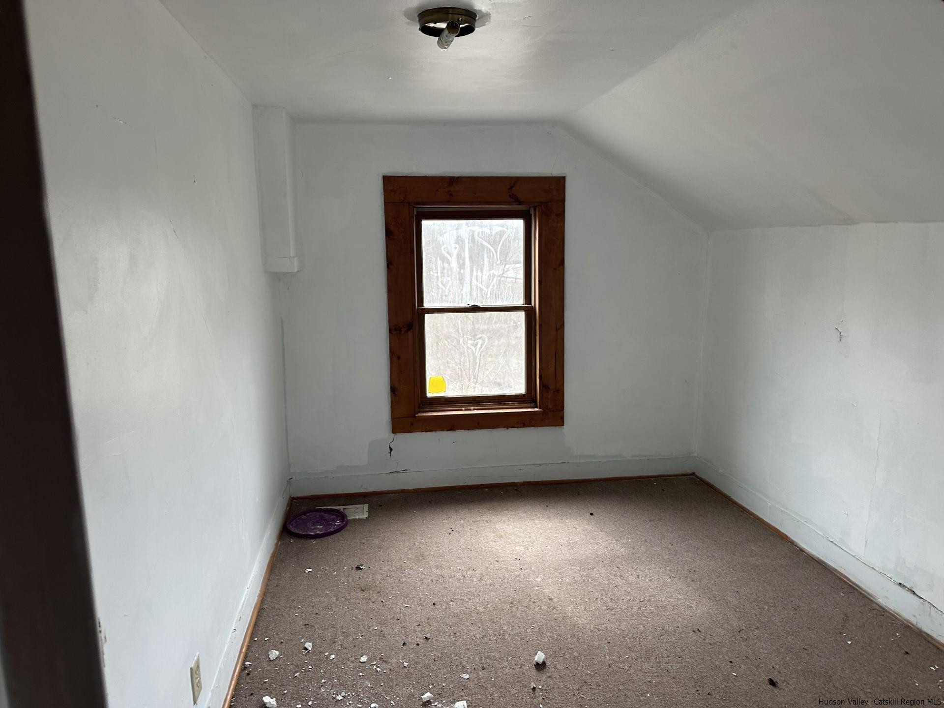 7 Old Rte 52, Unit 13 OLD ROUTE 52 Jeffersonville, NY 12748 - Photo 16 of 26 an empty room with a window