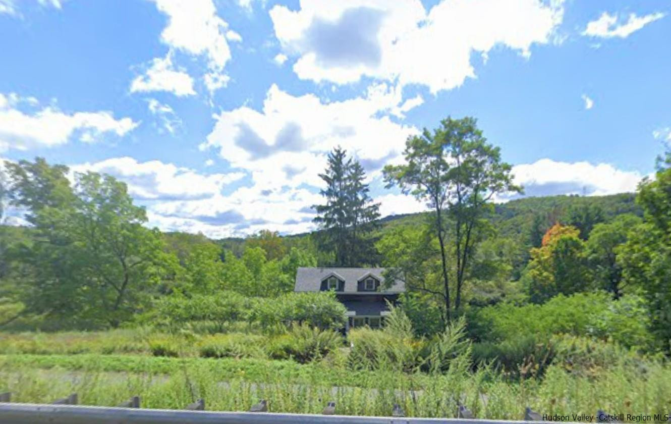 7 Old Rte 52, Unit 13 OLD ROUTE 52 Jeffersonville, NY 12748 - Photo 6 of 26 a view of a green field with lots of bushes