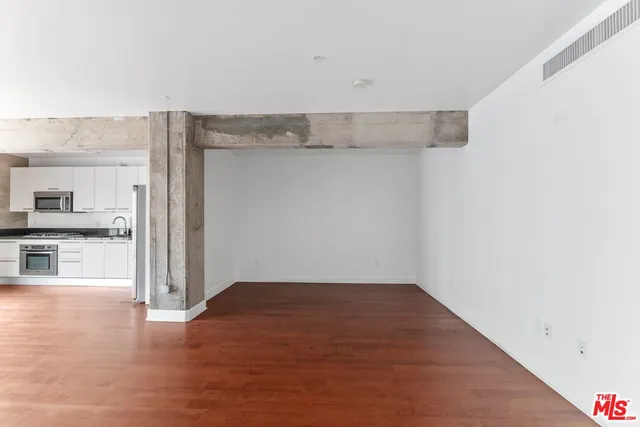 a view of a kitchen with wooden floor