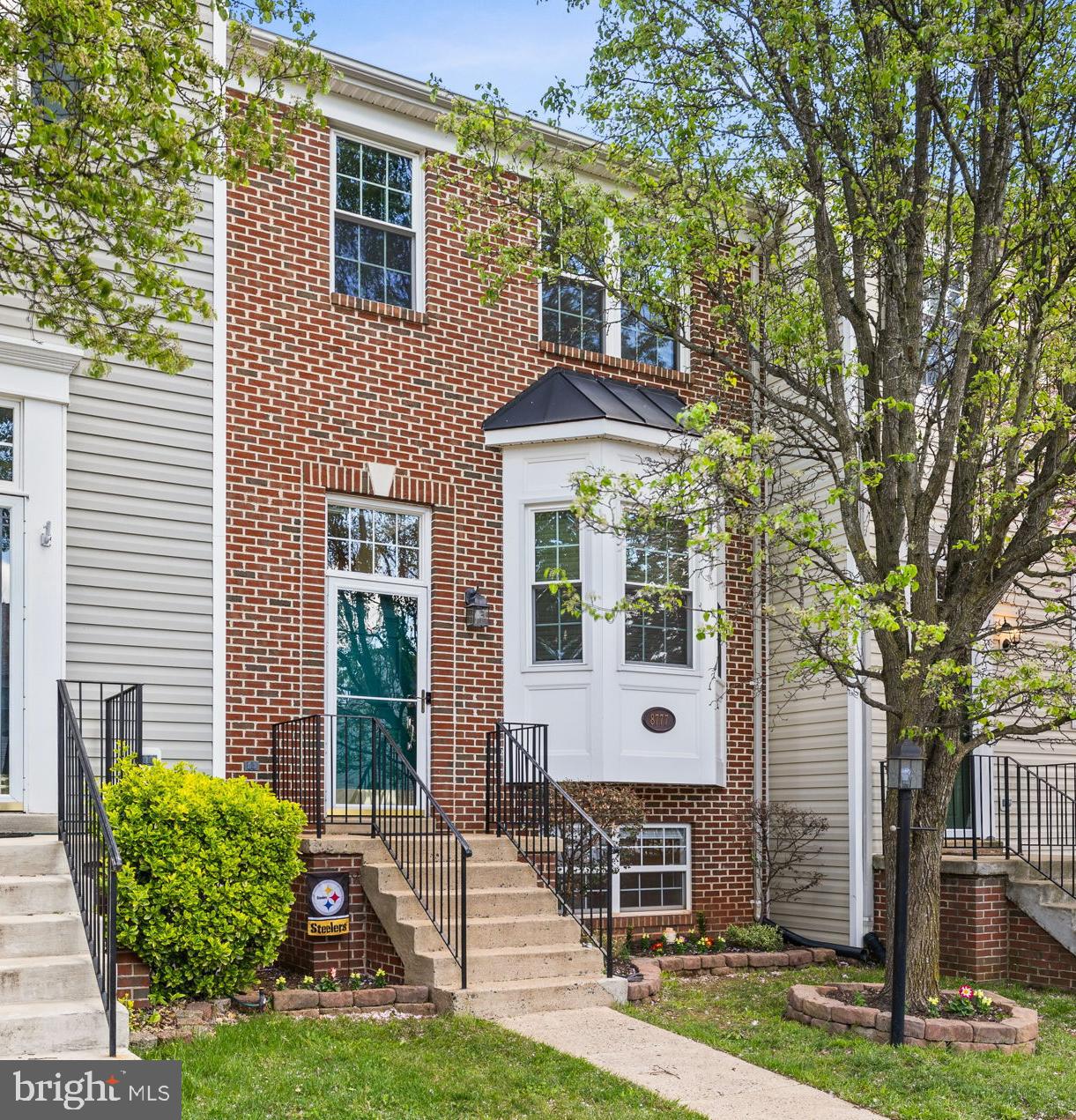 8777 Dunstable Loop Bristow, VA 20136 - Photo 1 of 25 a front view of a house with garden