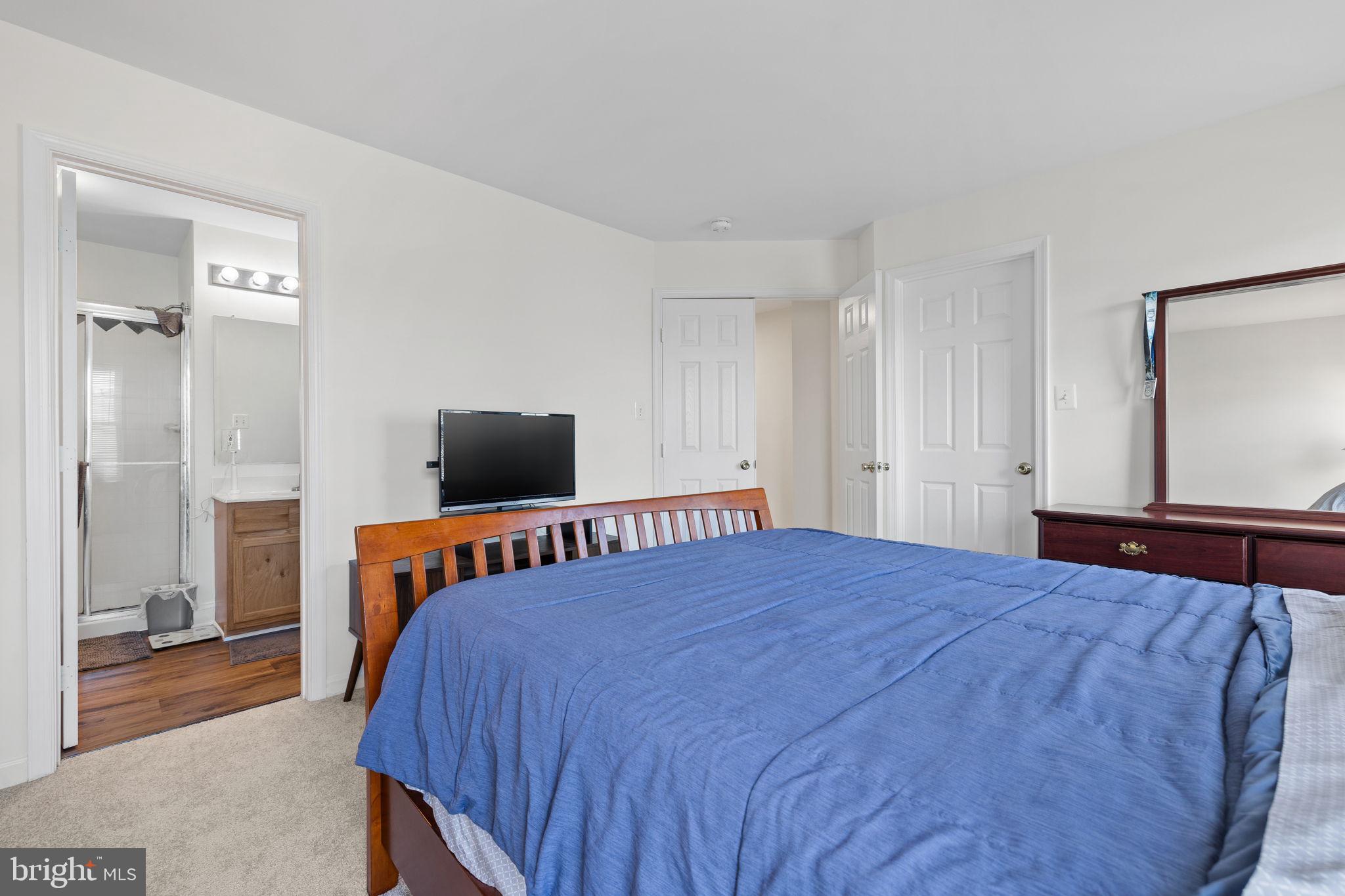 8777 Dunstable Loop Bristow, VA 20136 - Photo 11 of 25 a bedroom with a bed and a television