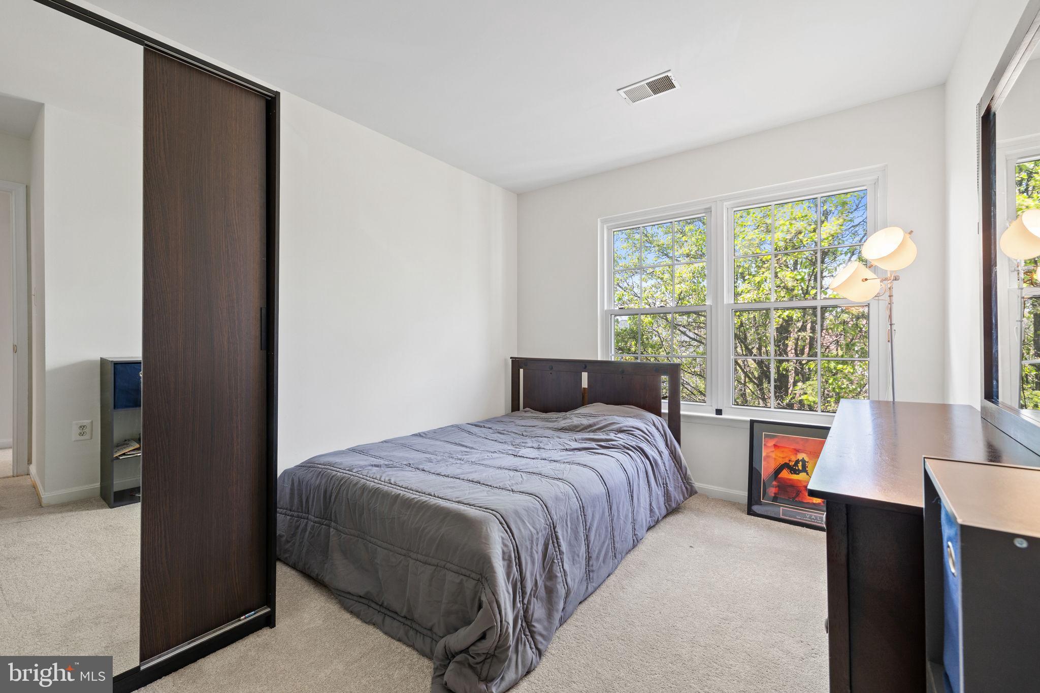 8777 Dunstable Loop Bristow, VA 20136 - Photo 13 of 25 a bedroom with a bed and a window