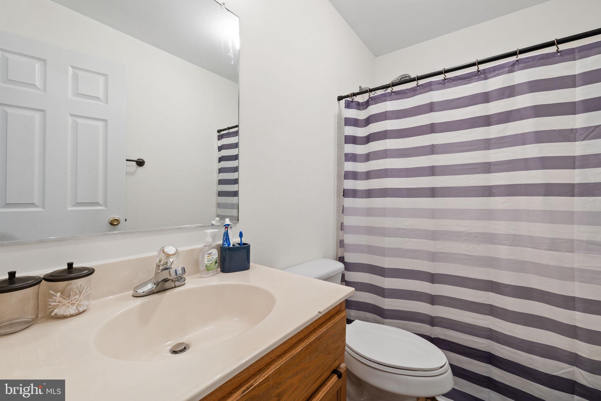 8777 Dunstable Loop Bristow, VA 20136 - Photo 15 of 25 a bathroom with a sink toilet and shower