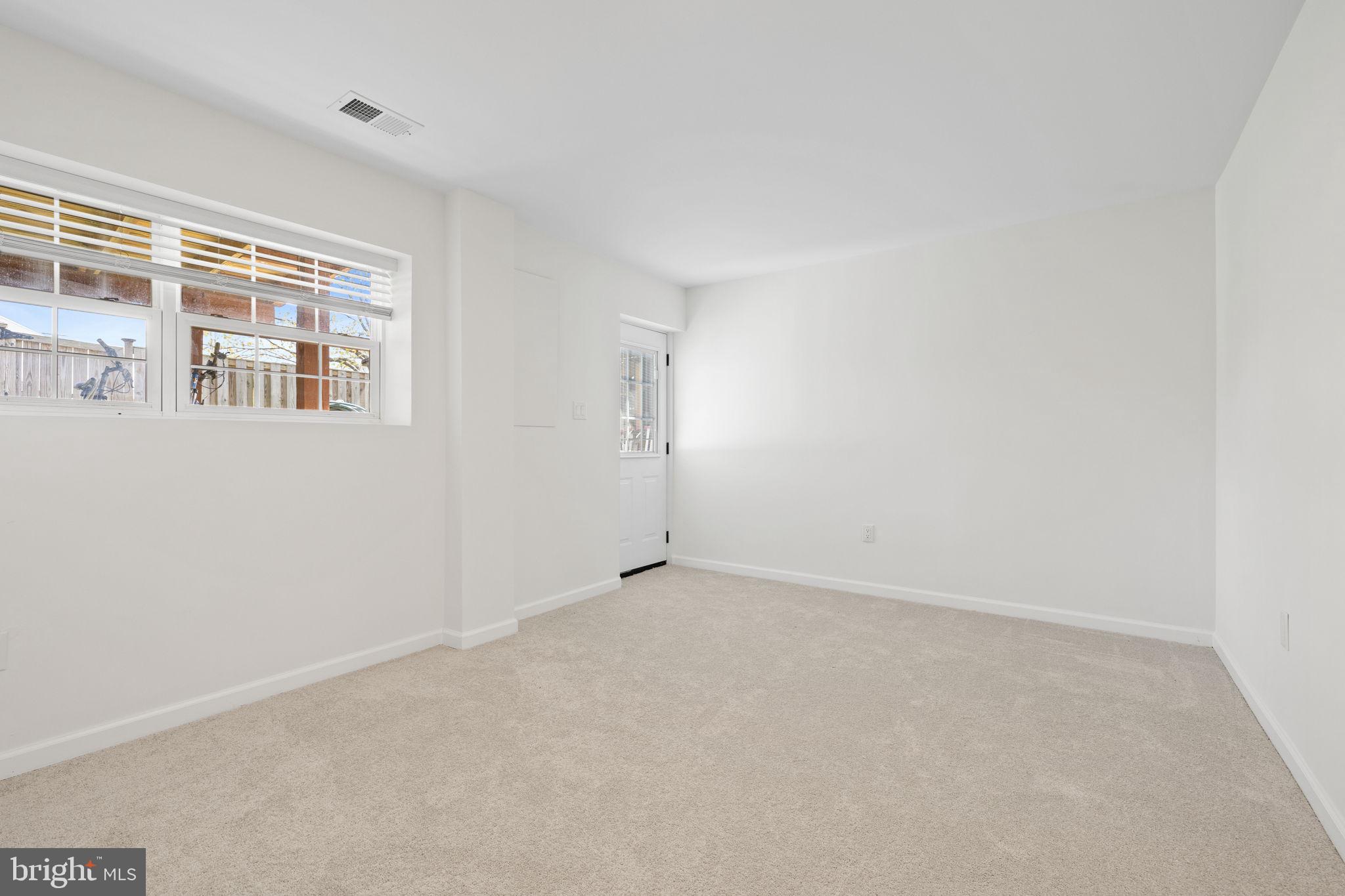 8777 Dunstable Loop Bristow, VA 20136 - Photo 17 of 25 an empty room with windows