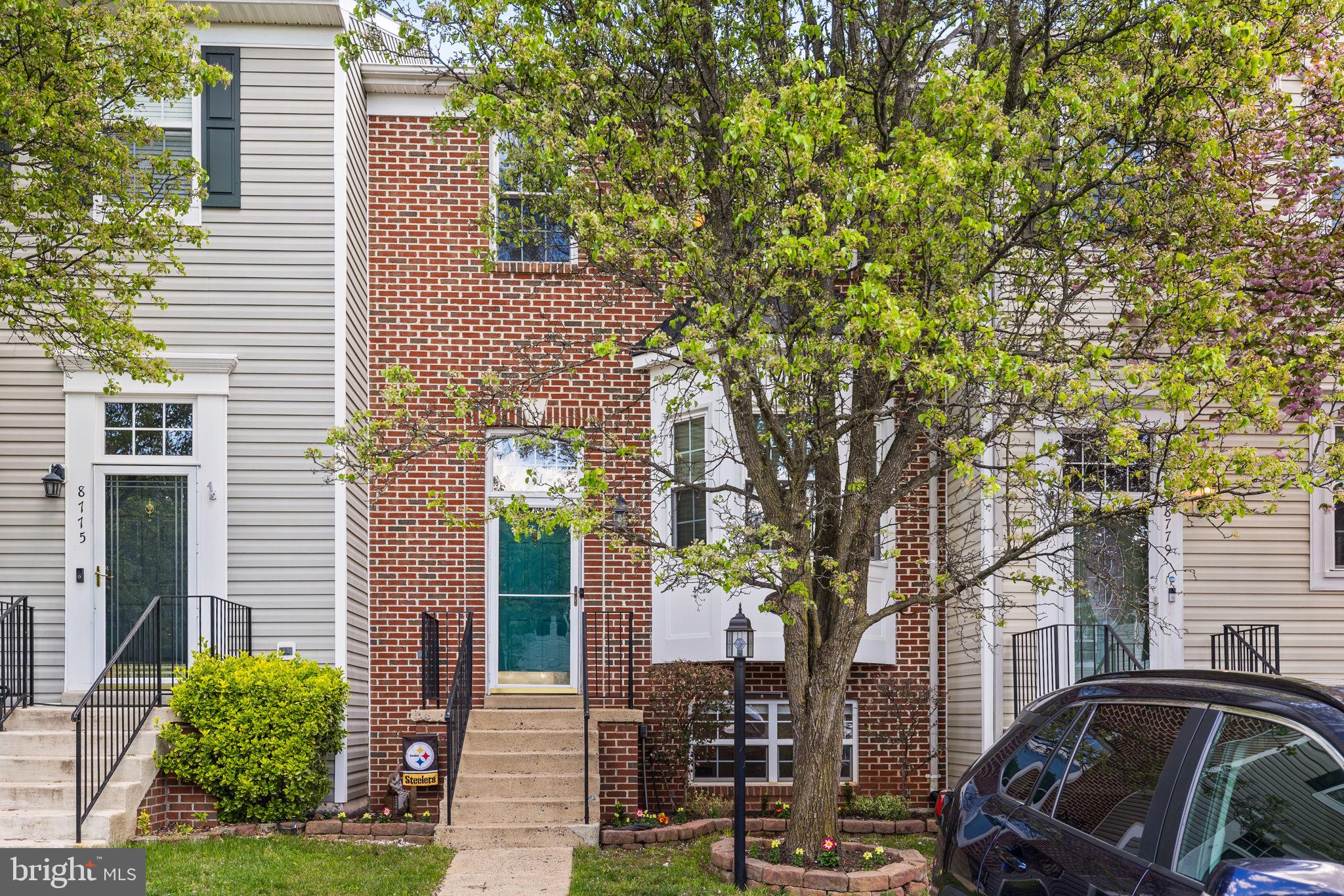8777 Dunstable Loop Bristow, VA 20136 - Photo 2 of 25 a view of a car park in front of a building