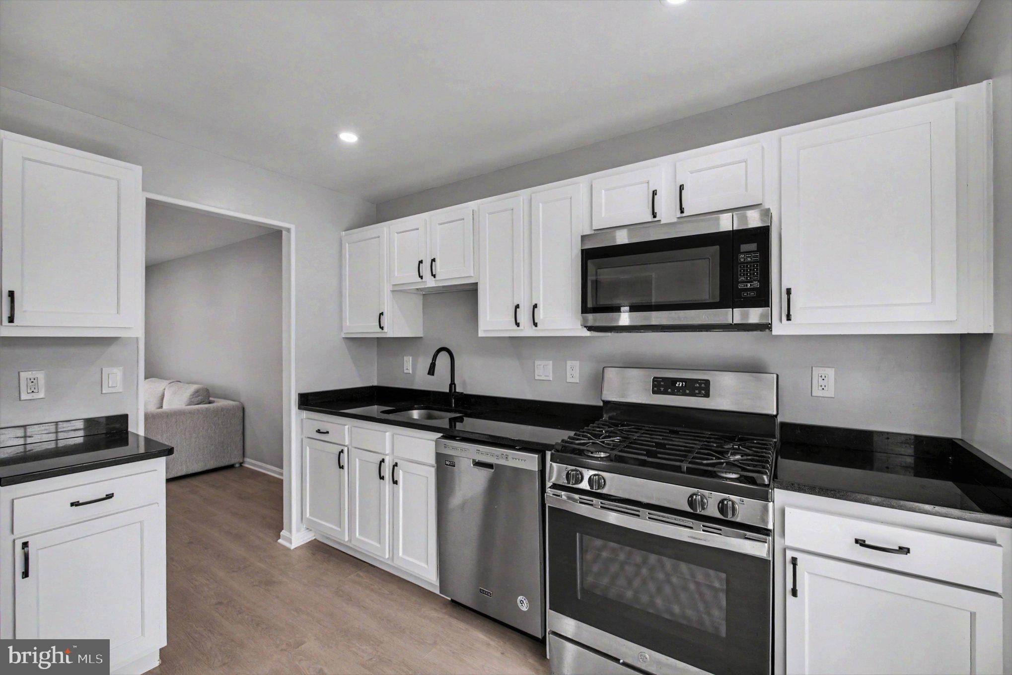 7981 Northumberland Road Springfield, VA 22153 - Photo 8 of 26 Modern kitchen with sleek finishes.