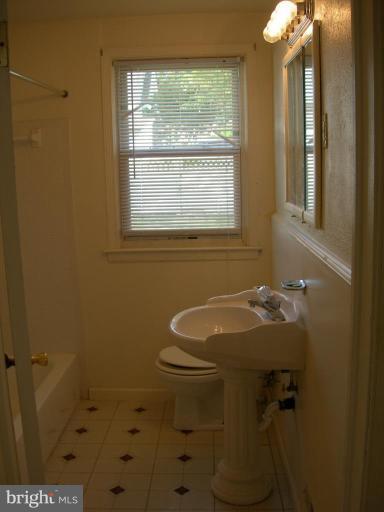 1815 Hanford Road Rosedale, MD 21237 - Photo 5 of 12 a bathroom with a sink and a toilet