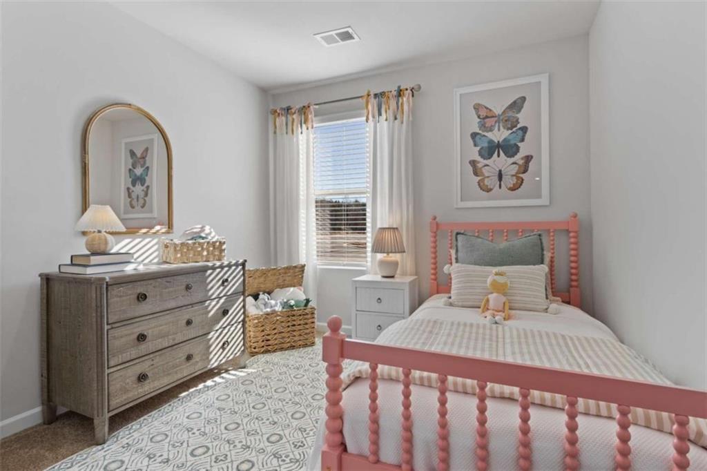 511 Azalea Way, Unit 54 Temple, GA 30179 - Photo 18 of 24 a bedroom with a bed and wooden floor