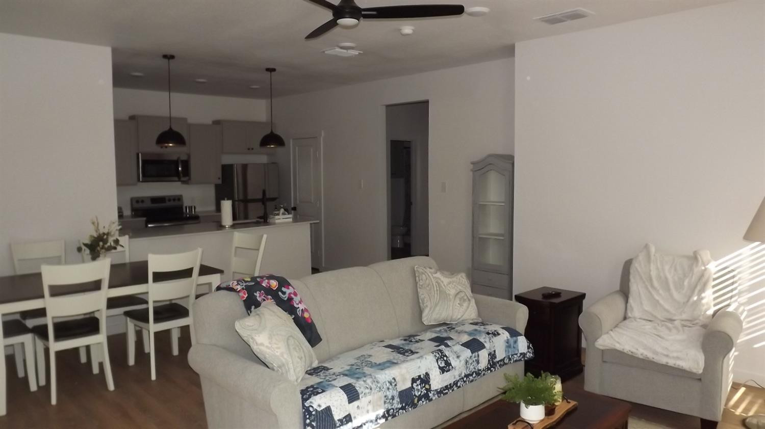5805 Virginia Avenue Lubbock, TX 79407 - Photo 4 of 9 a living room with furniture and a table
