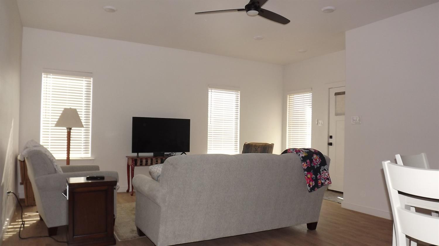 5805 Virginia Avenue Lubbock, TX 79407 - Photo 6 of 9 a living room with furniture and a flat screen tv
