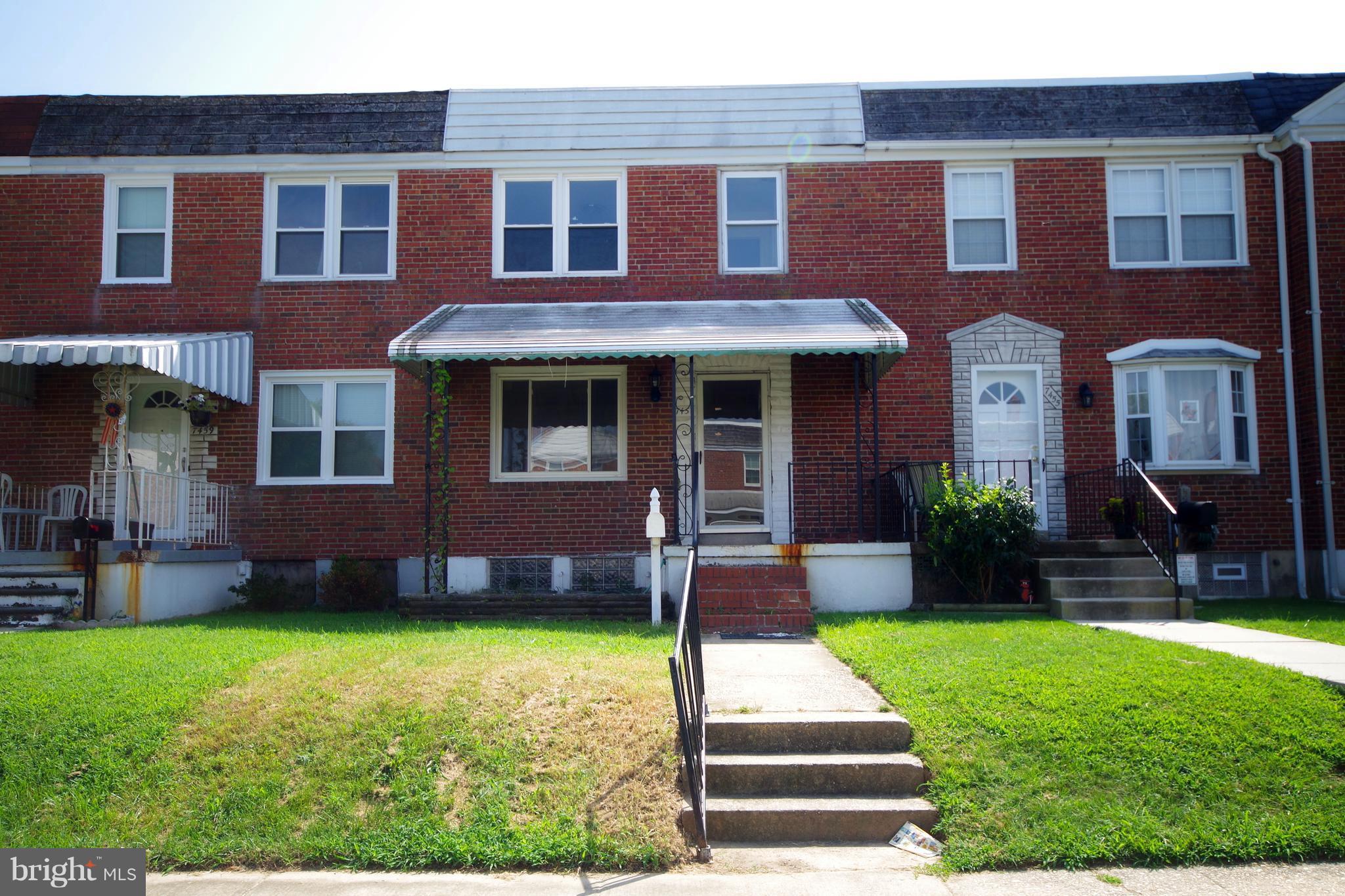 7457 Lawrence Road Dundalk, MD 21222 - Photo 1 of 24 a front view of a house with a yard
