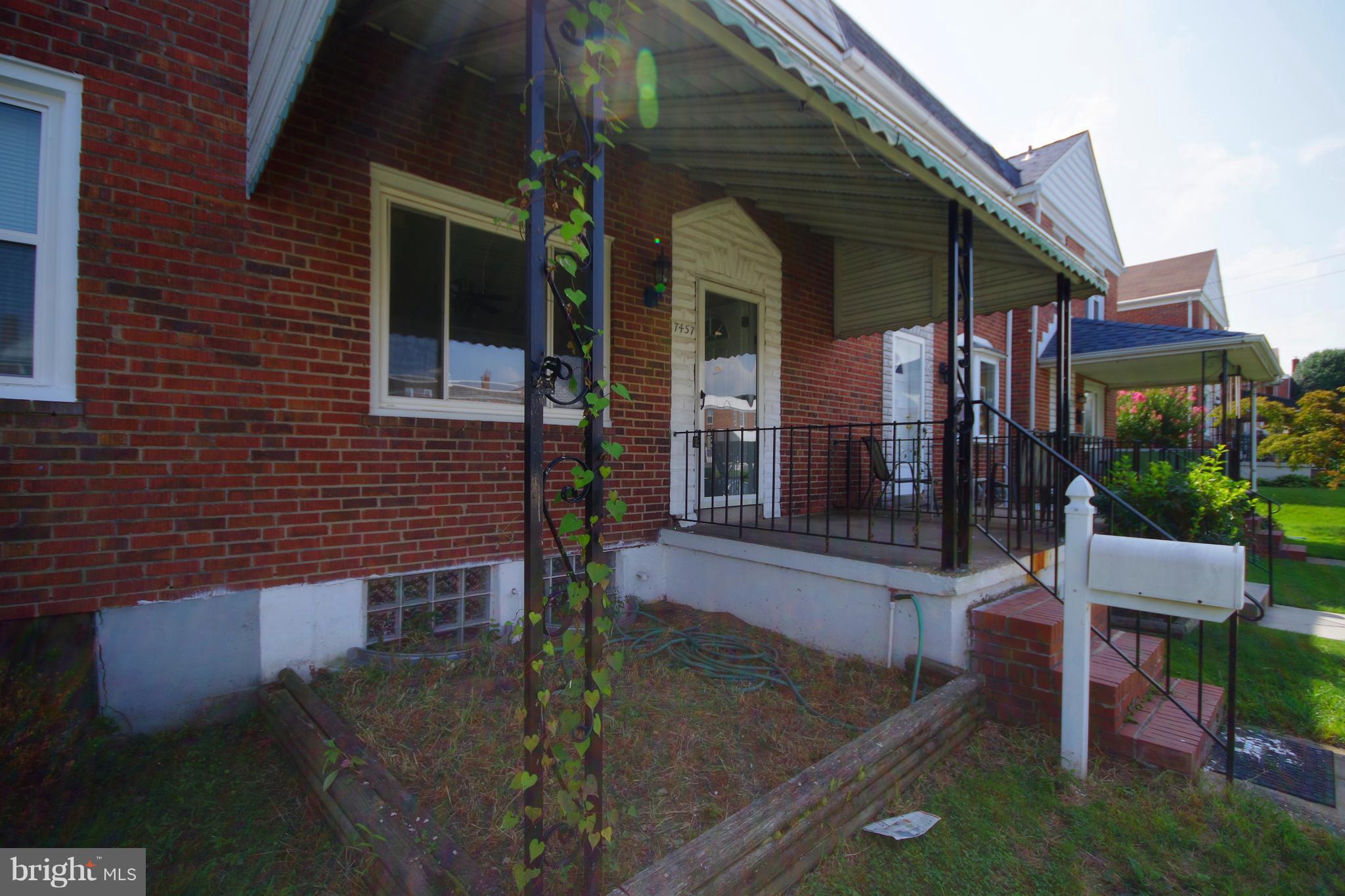 7457 Lawrence Road Dundalk, MD 21222 - Photo 2 of 24 a view of a house with backyard