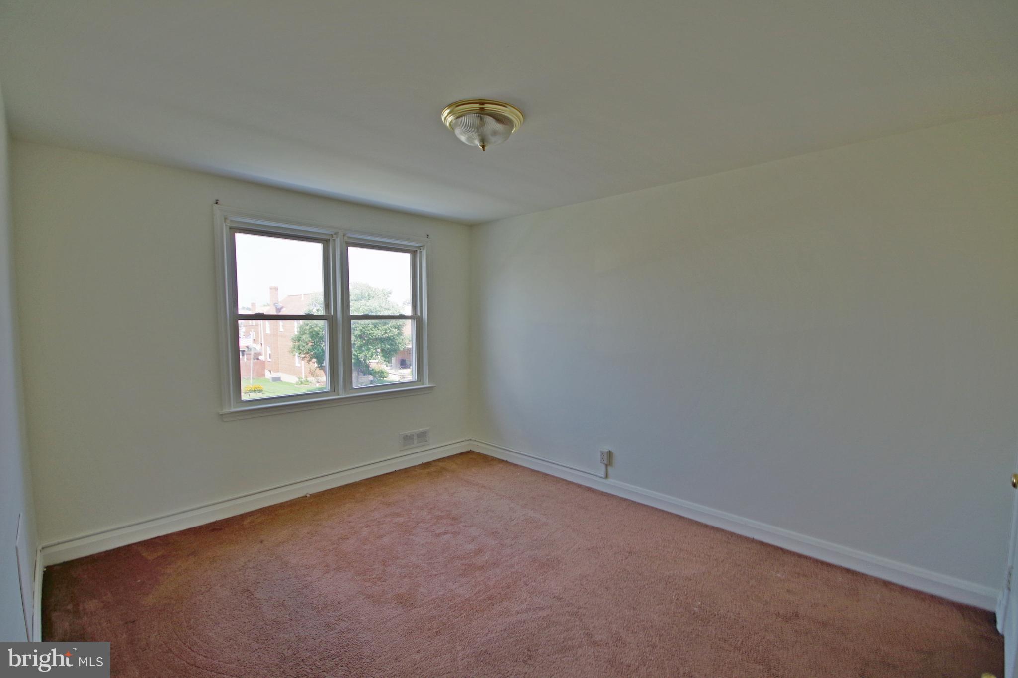 7457 Lawrence Road Dundalk, MD 21222 - Photo 11 of 24 an empty room with a window