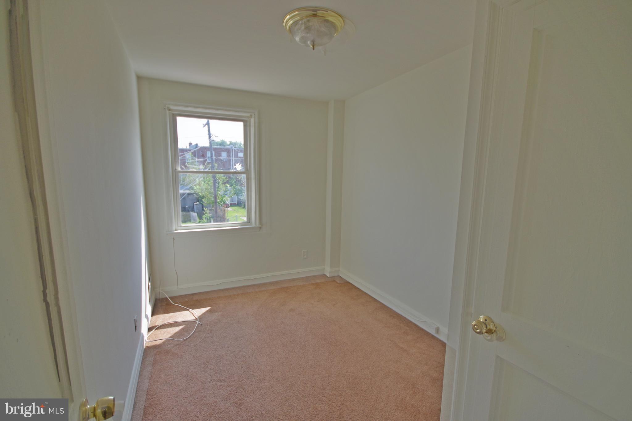 7457 Lawrence Road Dundalk, MD 21222 - Photo 14 of 24 an empty room with windows