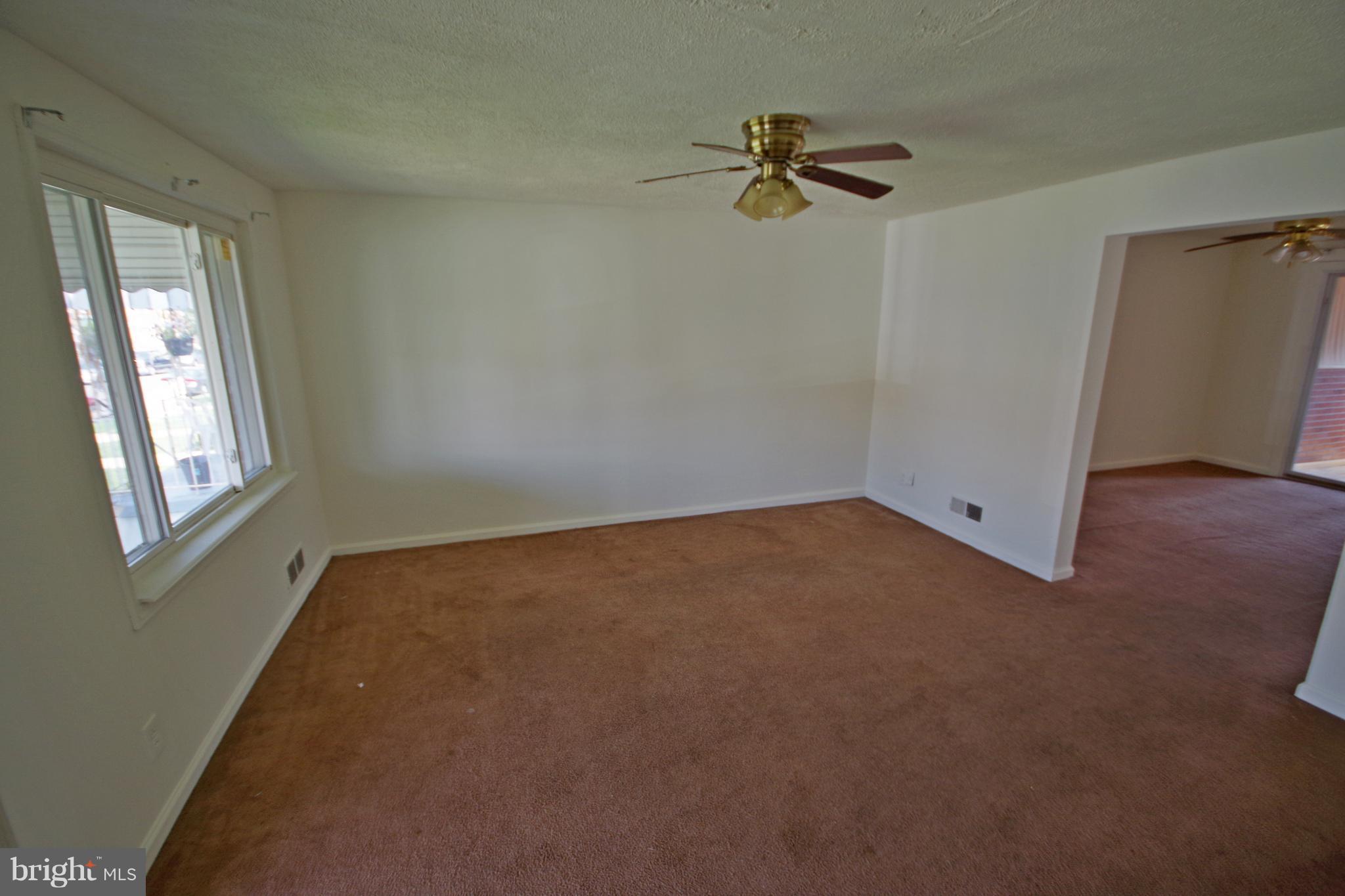 7457 Lawrence Road Dundalk, MD 21222 - Photo 6 of 24 an empty room with a window