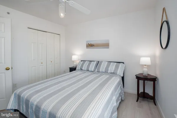 a bedroom with a bed and a table