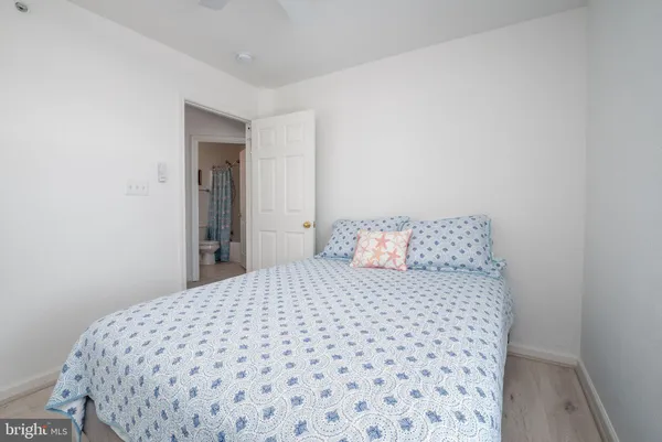 a bedroom with a bed and a chair