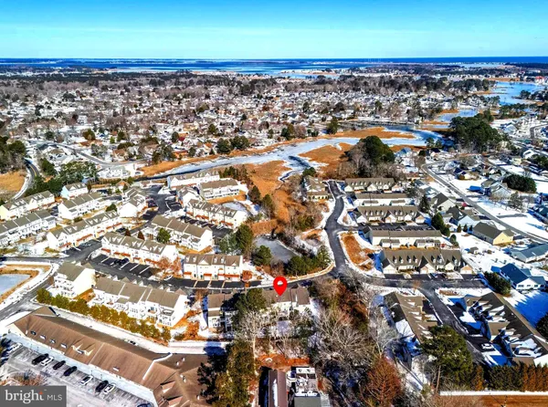 an aerial view of a residential houses with outdoor space