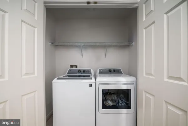 a stove top oven sitting inside of a kitchen