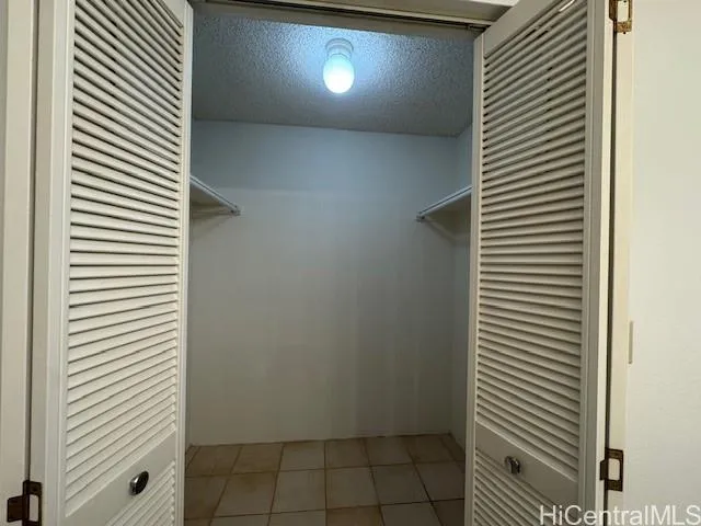 a view of a room with a door and a white wooden door