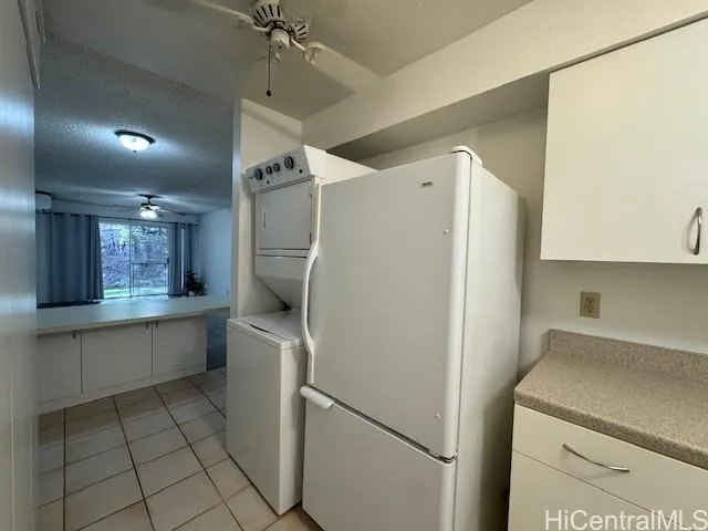 a kitchen with a refrigerator and a sink