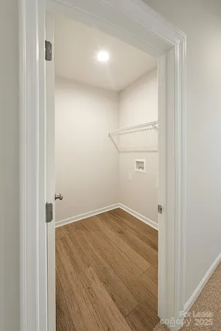 a spacious bathroom with a double vanity sink a toilet and a bathtub