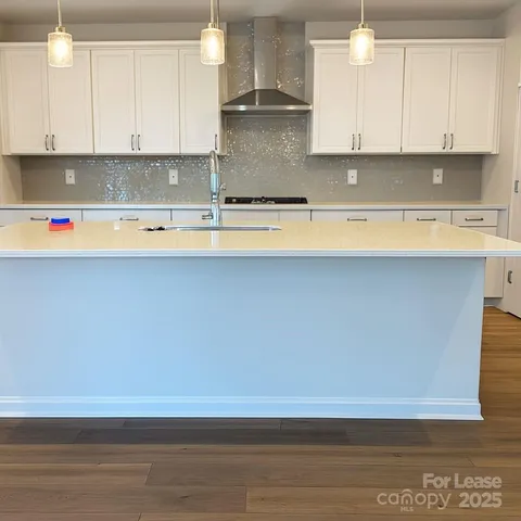 a view of kitchen with wooden floor