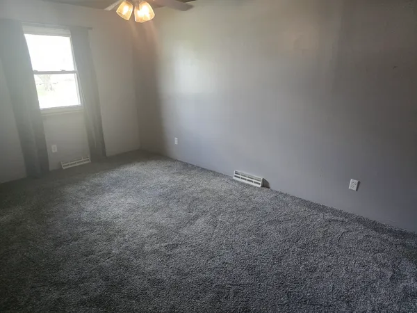 a view of an empty room and window