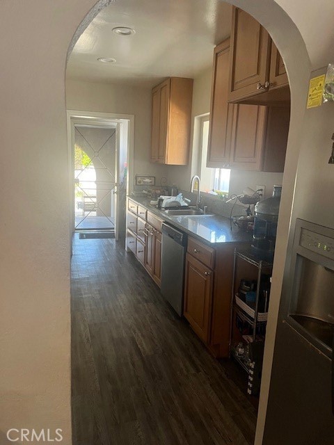 5130 Hedrick Avenue Riverside, CA 92505 - Photo 5 of 9 a view of a kitchen from the hallway