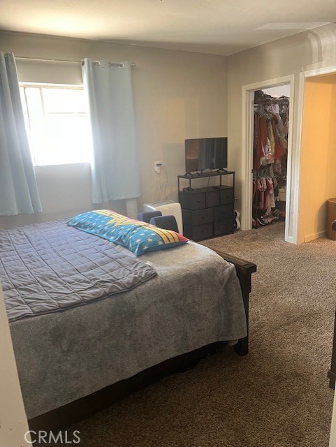 5130 Hedrick Avenue Riverside, CA 92505 - Photo 6 of 9 a bedroom with a bed and a window