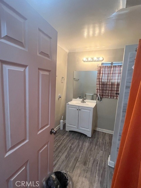 5130 Hedrick Avenue Riverside, CA 92505 - Photo 7 of 9 a bathroom with a sink mirror toilet and bath tub