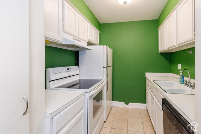 167 East 100 North, Unit B Logan, UT 84321 - Photo 5 of 18 Kitchen featuring white appliances, white cabinets, light countertops, and light tile patterned flooring