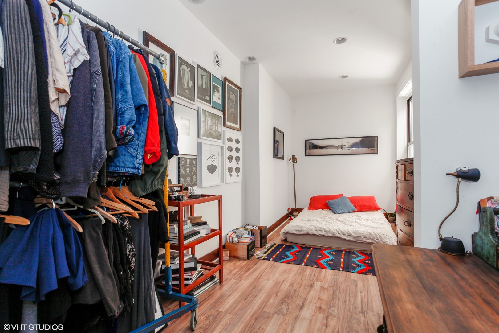 4837 West Irving Park Road, Unit 2 Chicago, IL 60641 - Photo 19 of 24 a view of walk in closet with clothes and shoes