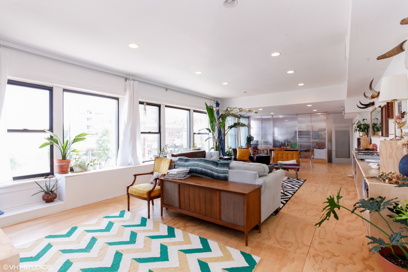 4837 West Irving Park Road, Unit 2 Chicago, IL 60641 - Photo 2 of 24 a living room with furniture fireplace and a large window