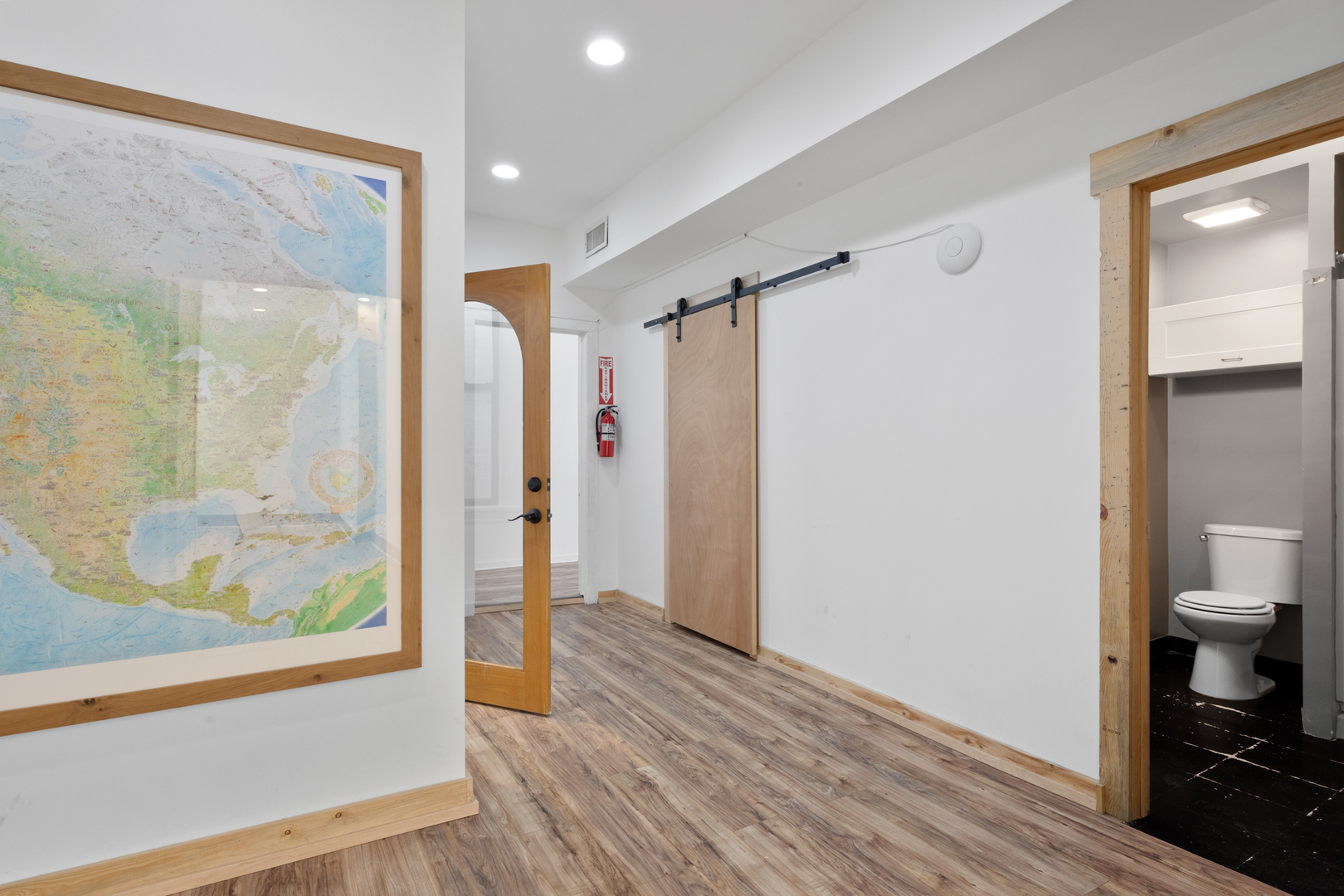 4837 West Irving Park Road, Unit 2 Chicago, IL 60641 - Photo 22 of 24 a view of hallway with bathroom and wooden floor