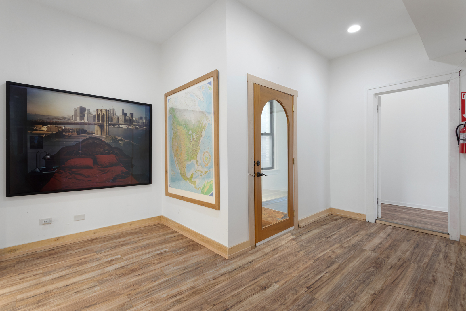 4837 West Irving Park Road, Unit 2 Chicago, IL 60641 - Photo 23 of 24 a view of a room with wooden floor and window