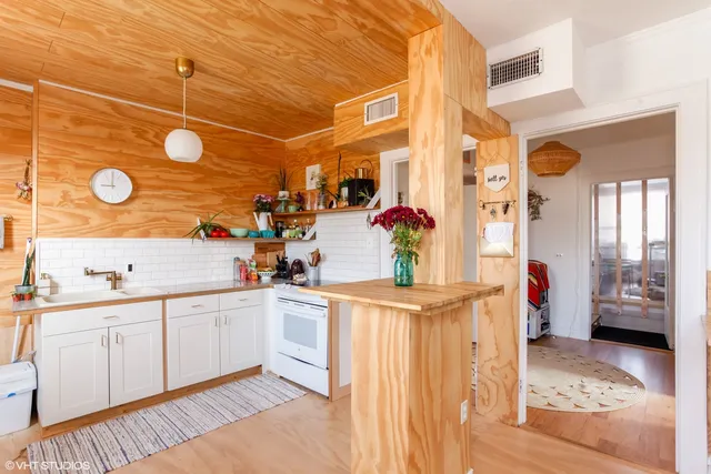 a kitchen with stainless steel appliances a sink and a cabinets