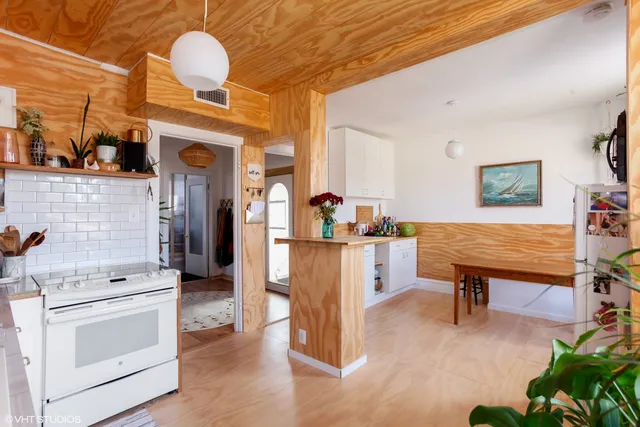 a view of living room with furniture and wooden floor