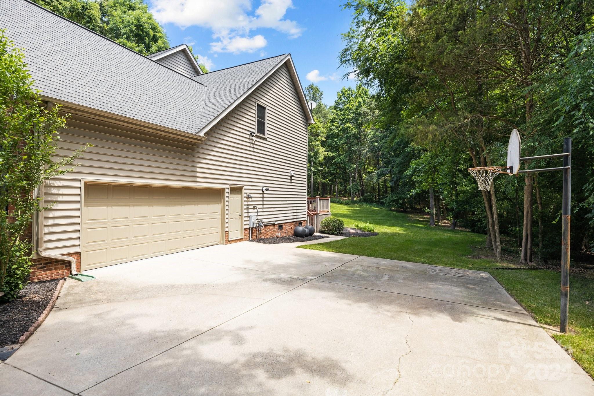 16009 Hamilton Forest Drive Fort Mill, SC 29708 - Photo 5 of 27 a view of a house with a yard and garage