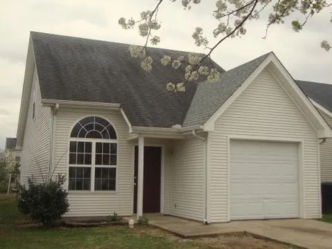 a front view of a house with a garage