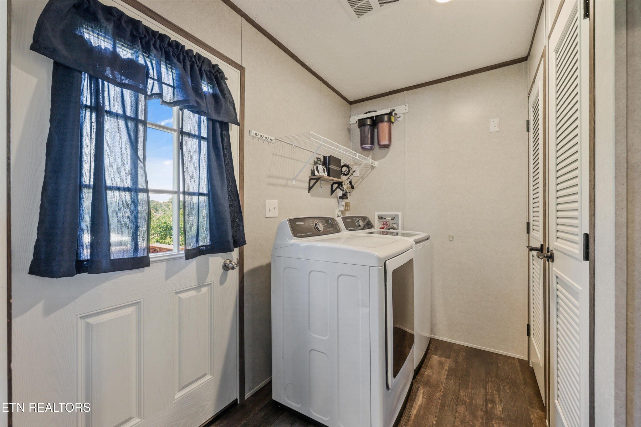 158 Frankfort Road Lancing, TN 37770 - Photo 15 of 46 a utility room with a sink dryer and washer